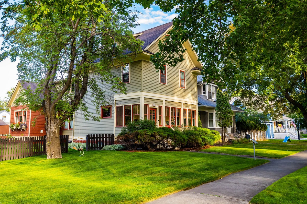 Beautiful residential houses along a sunny street in a charming neighborhood