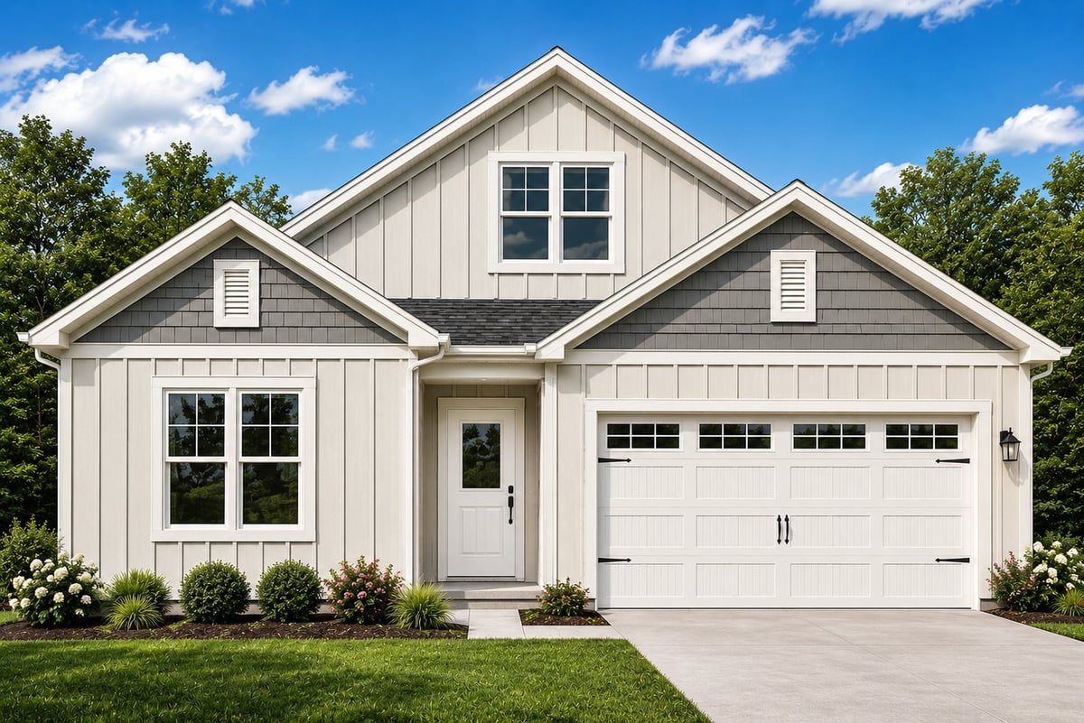 Modern white farmhouse with two-car garage, front porch, and landscaping against blue sky